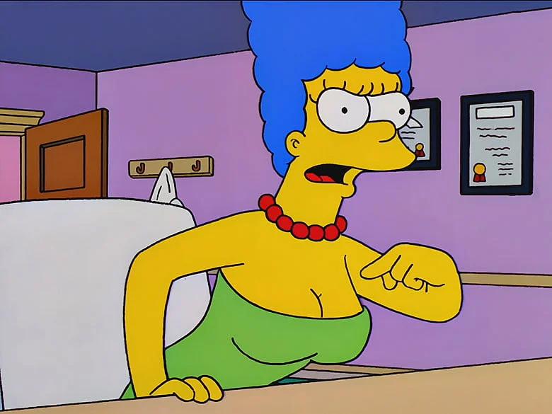 marge simpson angrily confronts the doctor about her breasts
